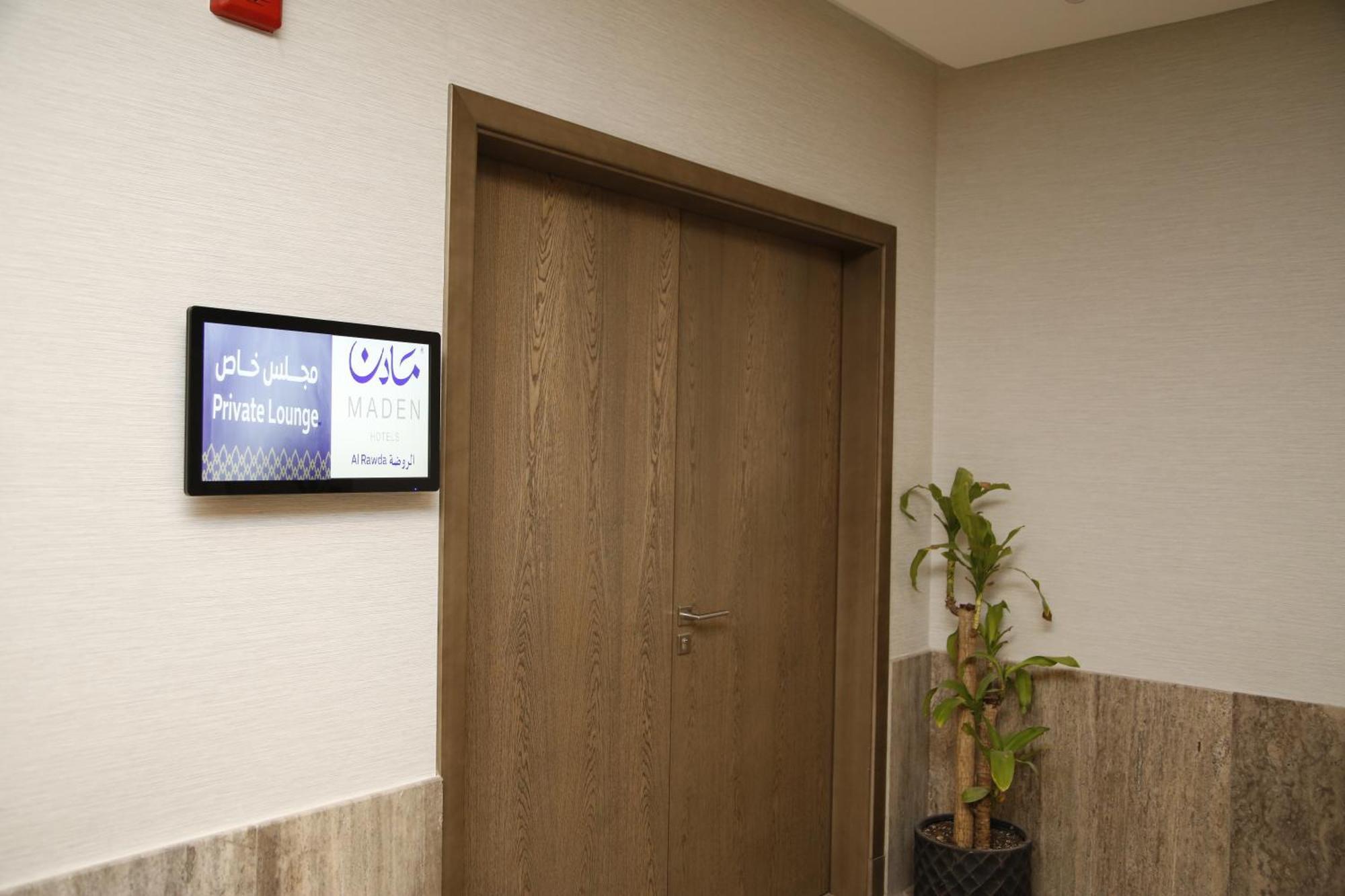 Maden Alrawda Hotel Medina Exterior photo A digital signage screen in a hospital