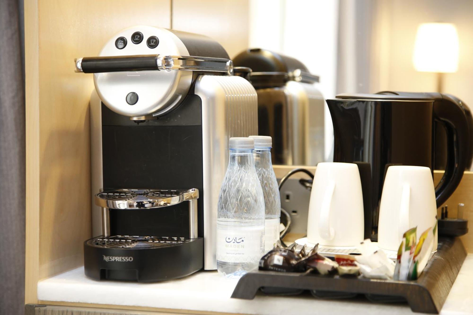 Maden Alrawda Hotel Medina Exterior photo A Nespresso coffee machine