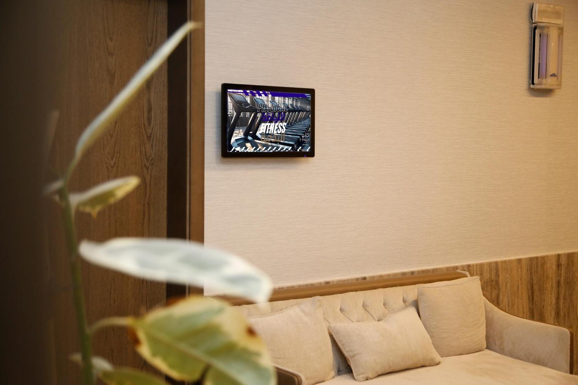 Maden Alrawda Hotel Medina Exterior photo A wall-mounted tablet